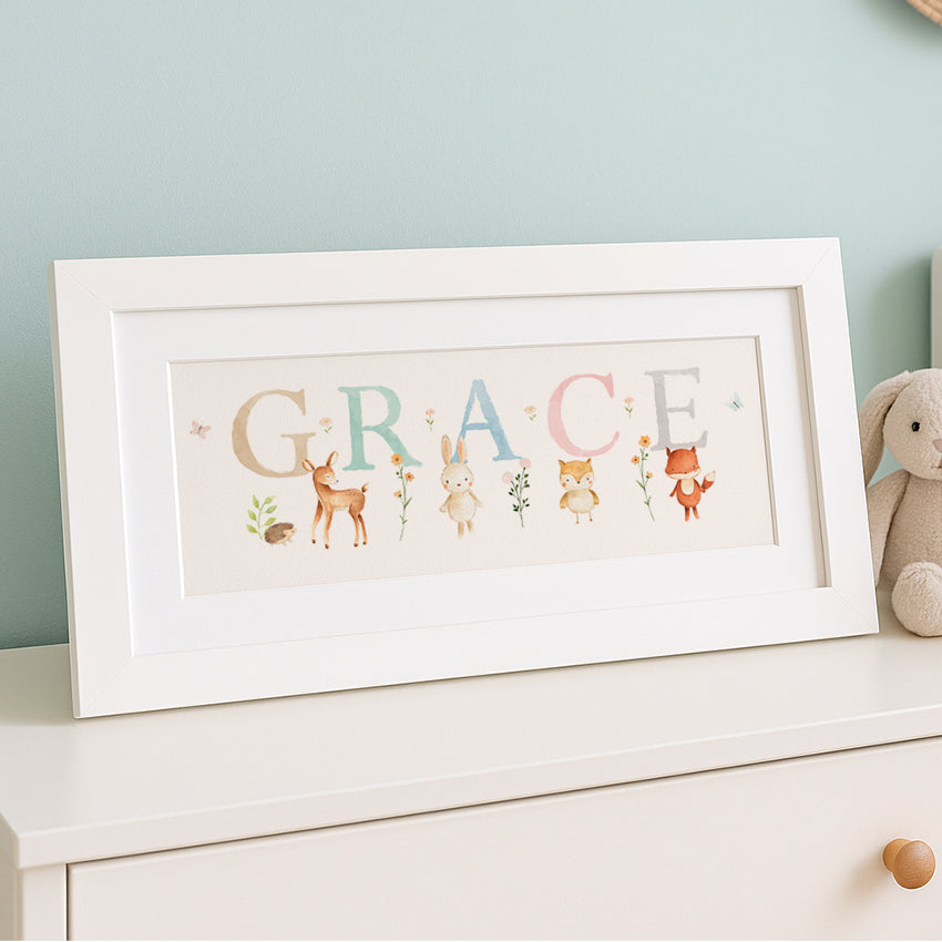 Framed artwork with 'GRACE' and animal illustrations on a white surface.